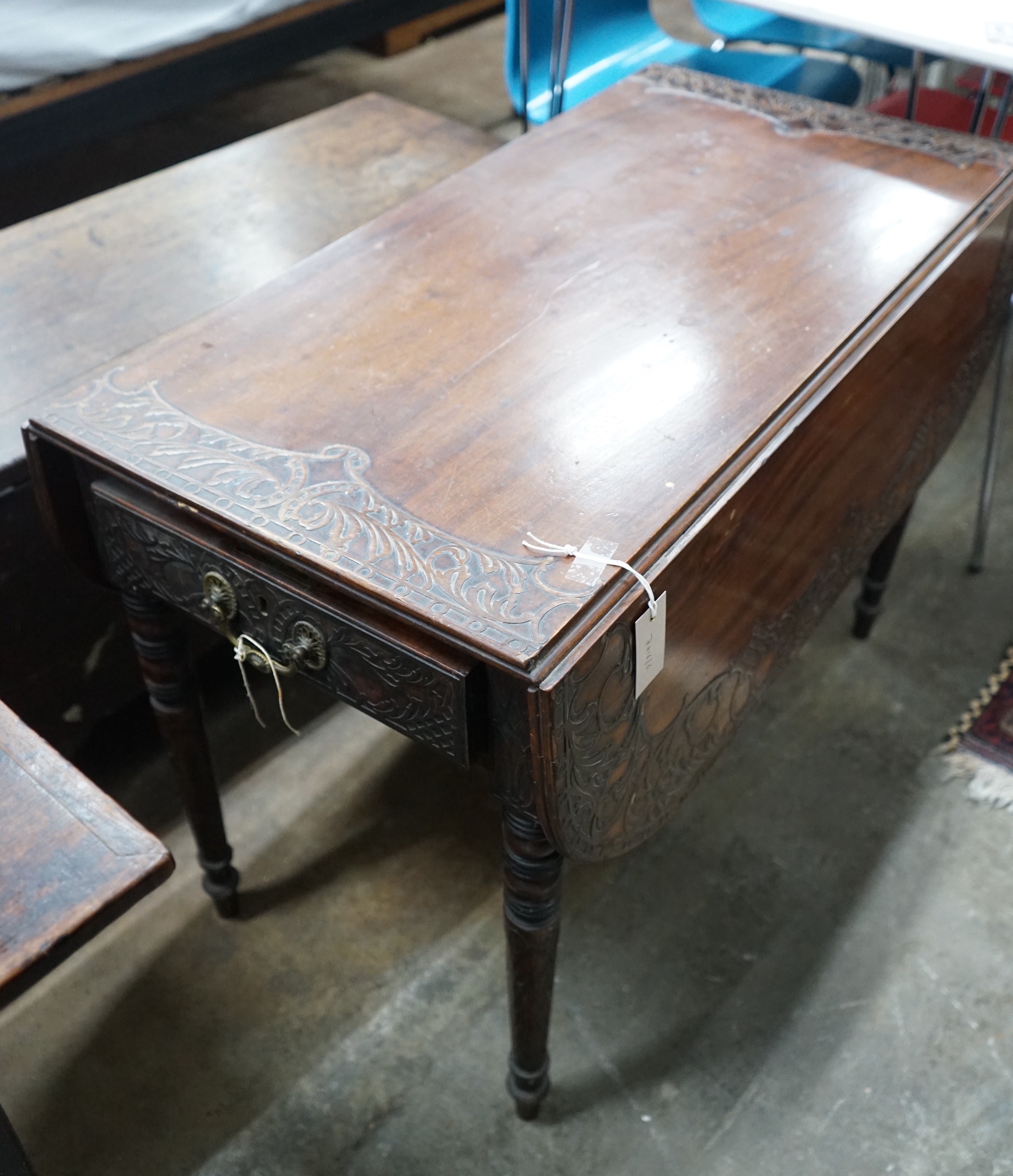 A Regency mahogany Pembroke table, later carved, width 89cms, depth 47cms, height 66cms.